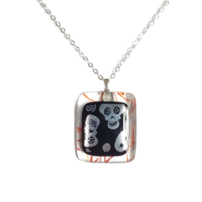 Dichroic sugar skulls on red stringer fused glass necklace