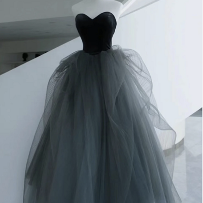 Strapless black tulle prom gown with flowing skirt 