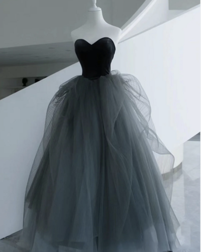 Strapless Black Tulle Prom Gown With Flowing Skirt 