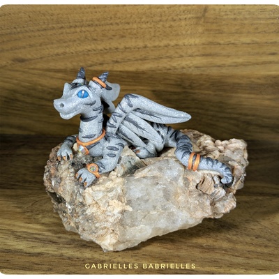 Clawdia the tabby dragon polymer clay sculpture on raw quartz crystal rock